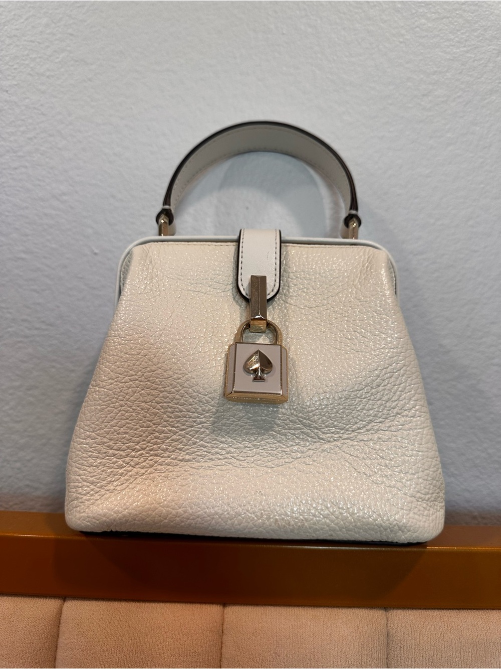 kate spade Cream Pebbled Leather Top-Handle Bag with Spade Lock